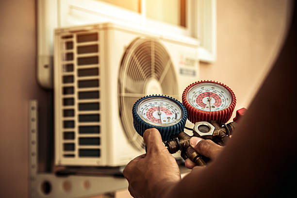 Professional Heat Pump Repair technician working in Brewster, MA